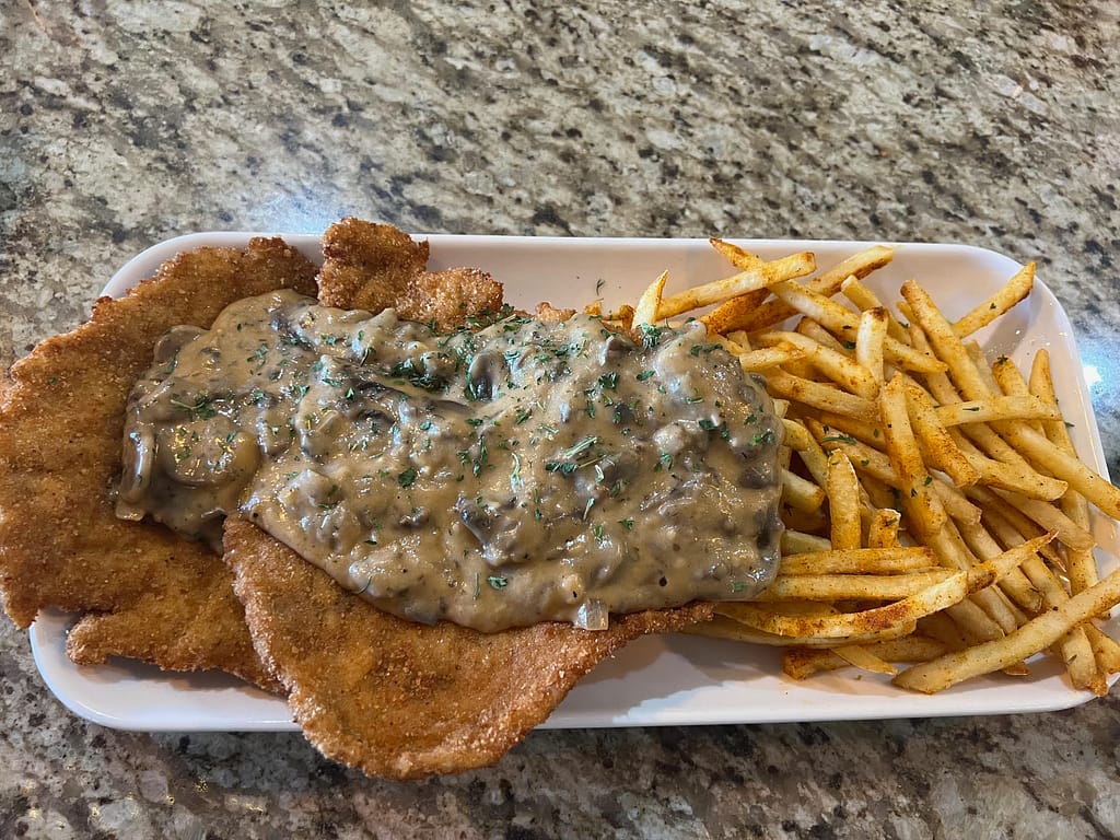 schnitzel, Jaeger style, smothered in a savory mushroom sauce