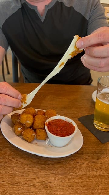 the hand-breaded mozzarella sticks