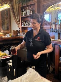 Peggy Board serving up drinks at the saloon in Linebergers where she has worked for over 20 years!